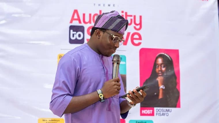 A speaker on stage at HultPrize UNIOSUN